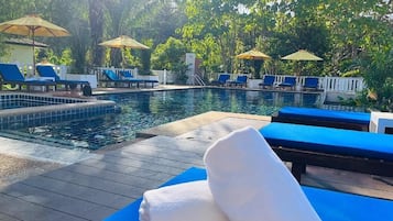 Outdoor pool, open 7:00 AM to 9:00 PM, pool umbrellas, pool loungers