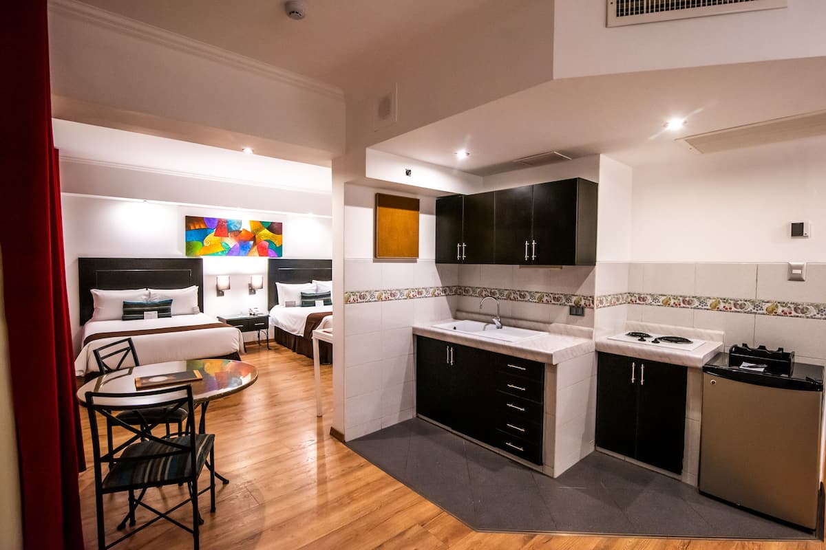 deluxe suite, 2 double beds | down duvets, minibar, in-room safe, desk