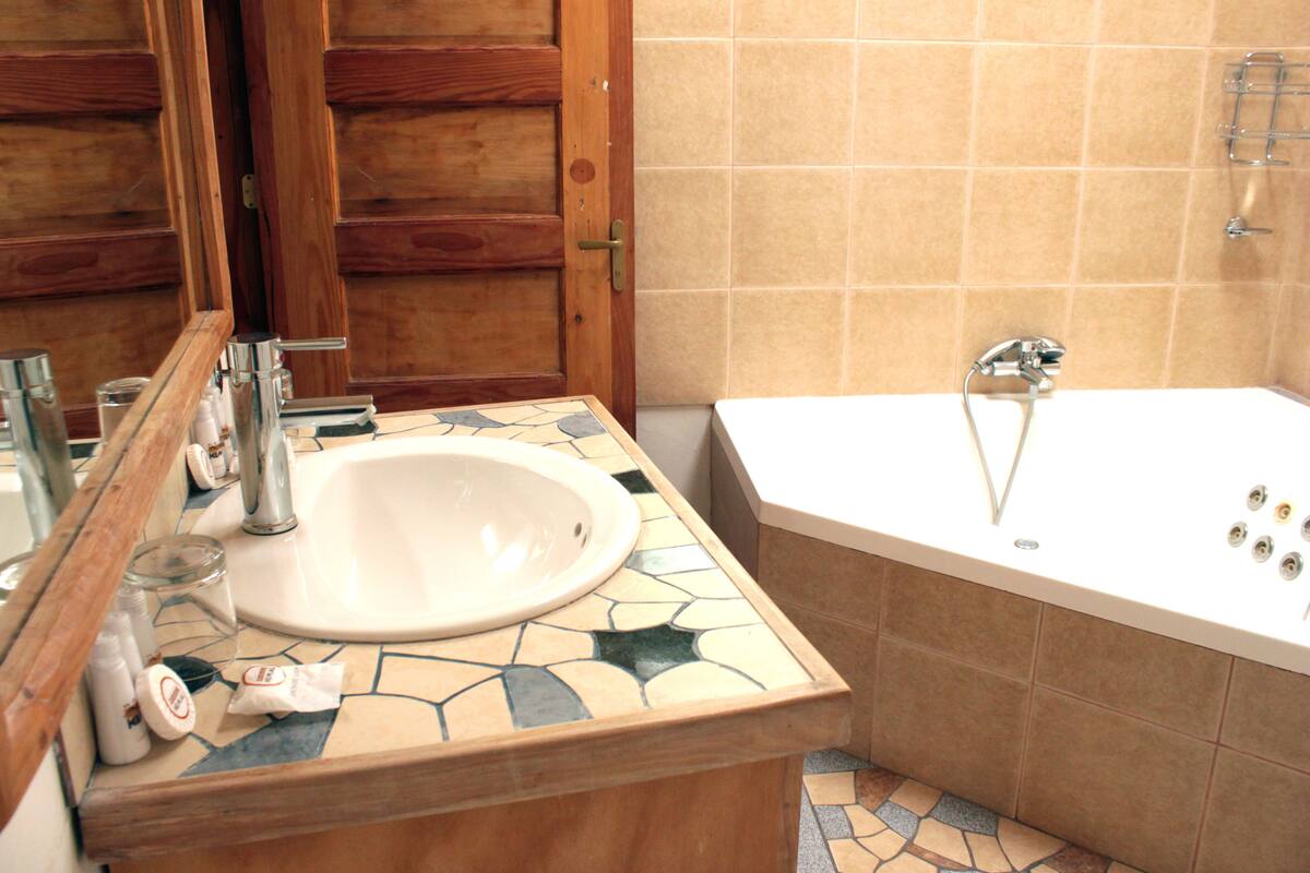 superior double room | bathroom | shower, free toiletries, hair dryer, towels