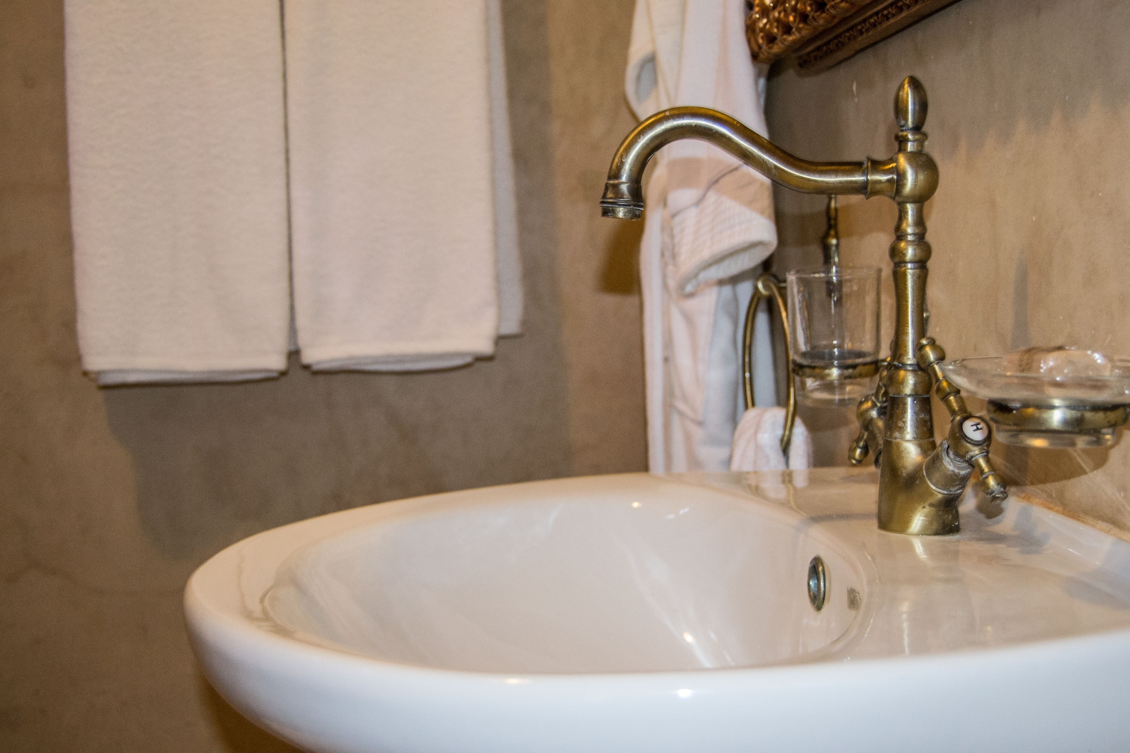 deluxe double room | bathroom | hair dryer, towels