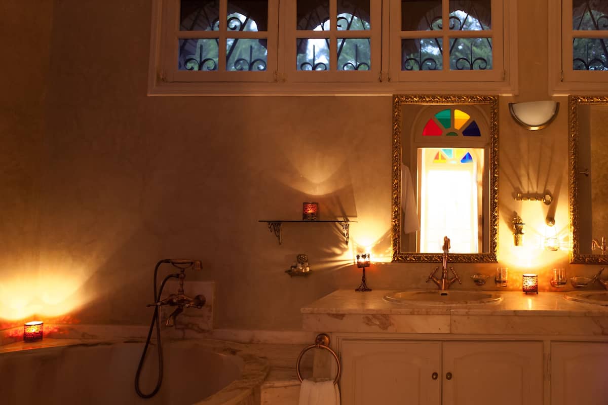 executive suite | bathroom | hair dryer, towels