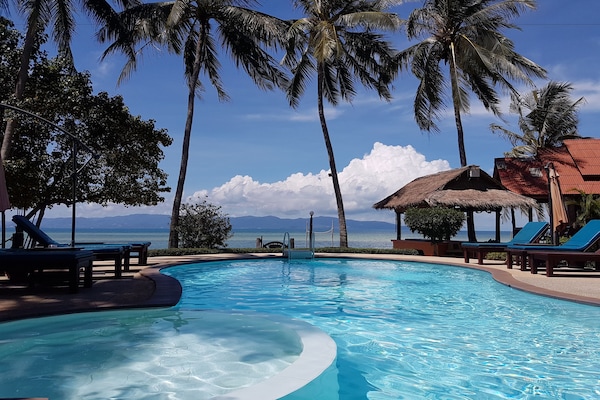 Outdoor pool, pool umbrellas, sun loungers
