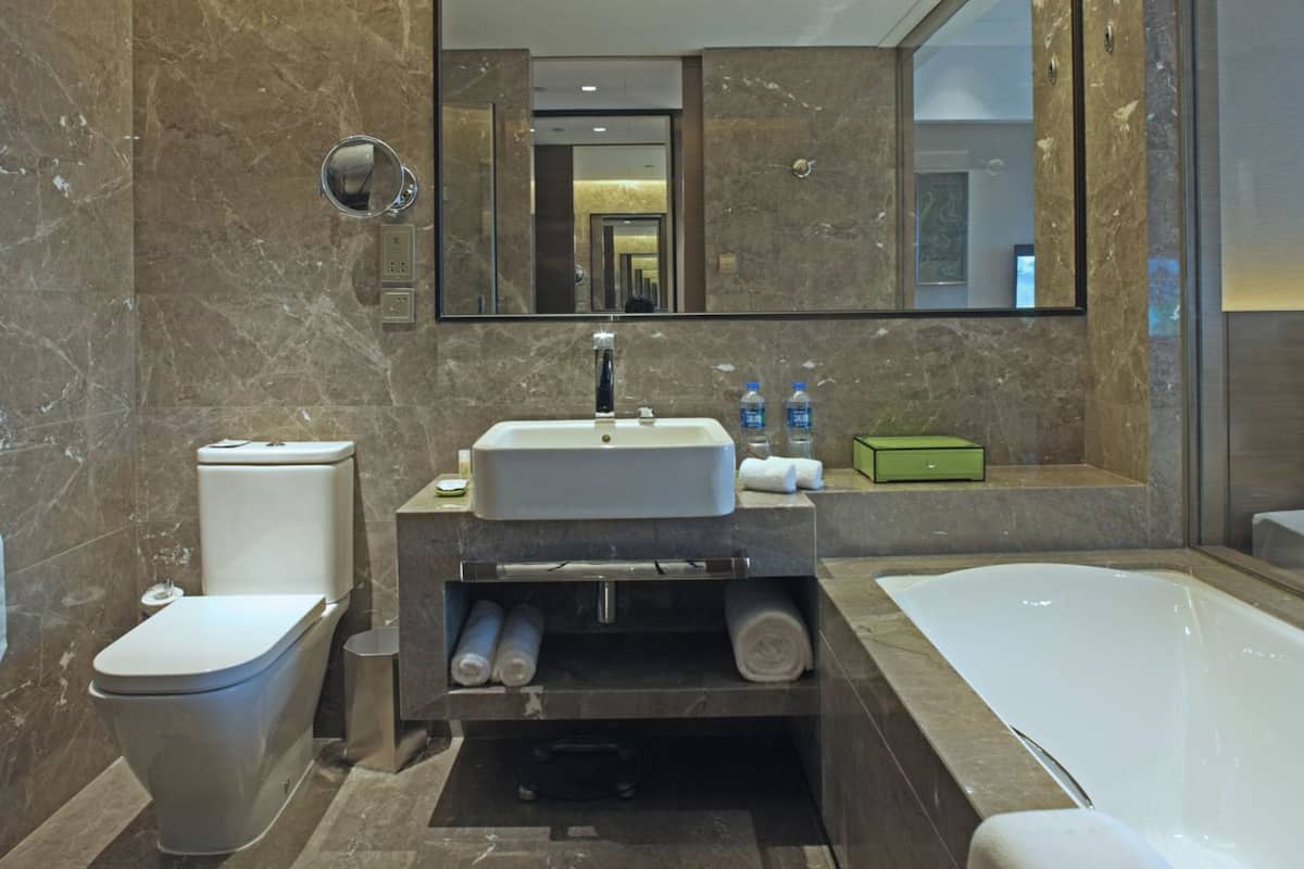 designer toiletries, hair dryer, bathrobes, slippers