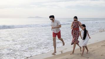 On the beach, white sand, free beach cabanas, sun-loungers