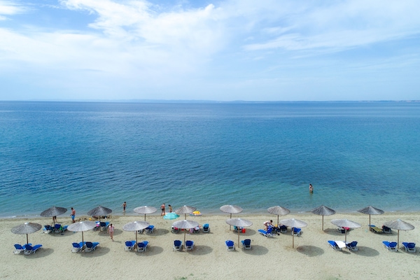 On the beach, sun loungers, beach towels, snorkeling