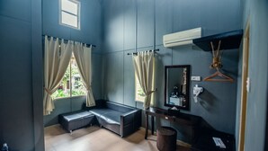 A room with a bench, a mirror, a hanging towel, and a window with curtains. - Sentosa Villa (Taiping)