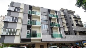 A multi-story building with balconies, large windows, and a ground-level entrance. - 12FLY Hotel (Kuala Lumpur)