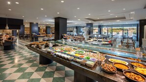 A buffet area with various food stations and a checkered floor pattern. - Hotel Gran Canaria Princess - Adults Only (+16) (San Bartolomé de Tirajana)