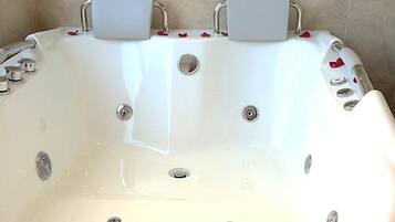 Designer toiletries, hair dryer, towels