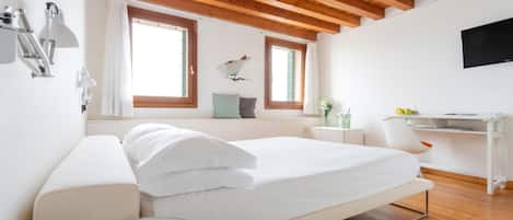 Roupas de cama premium, frigobar, escrivaninha, Wi-Fi de cortesia