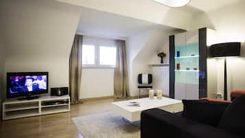 Comfort Apartment, 1 Bedroom | Living room | Flat-screen TV, DVD player