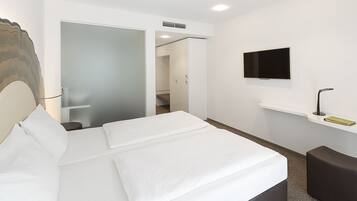 Hypo-allergenic bedding, free minibar, in-room safe, desk