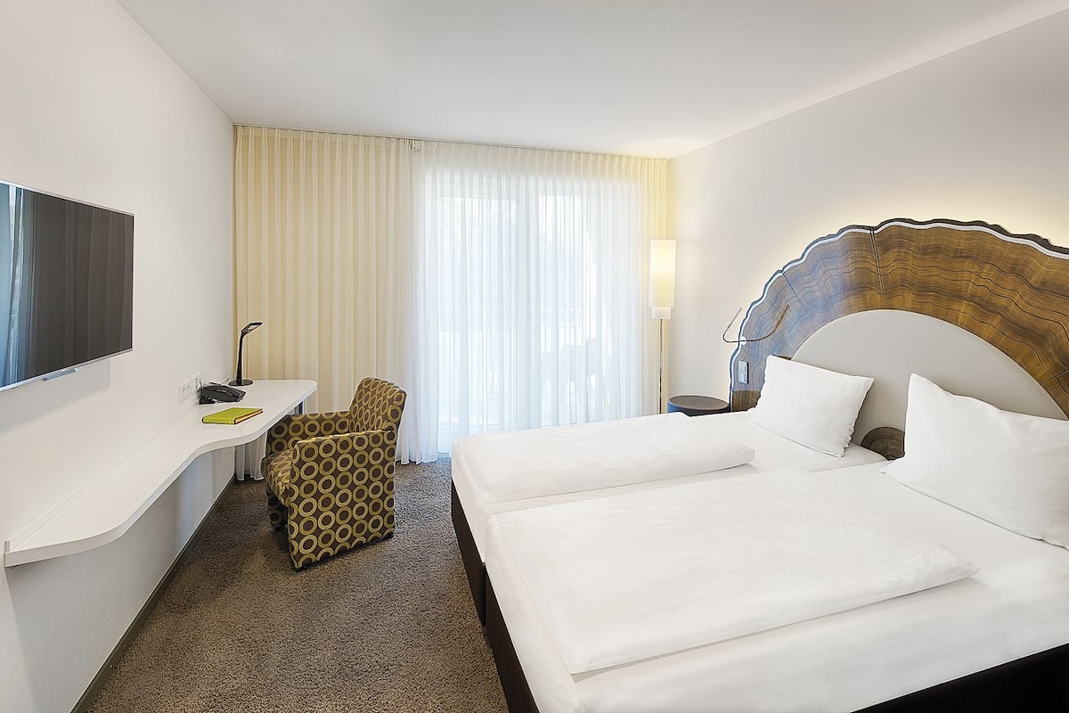 Hypo-allergenic bedding, free minibar, in-room safe, desk