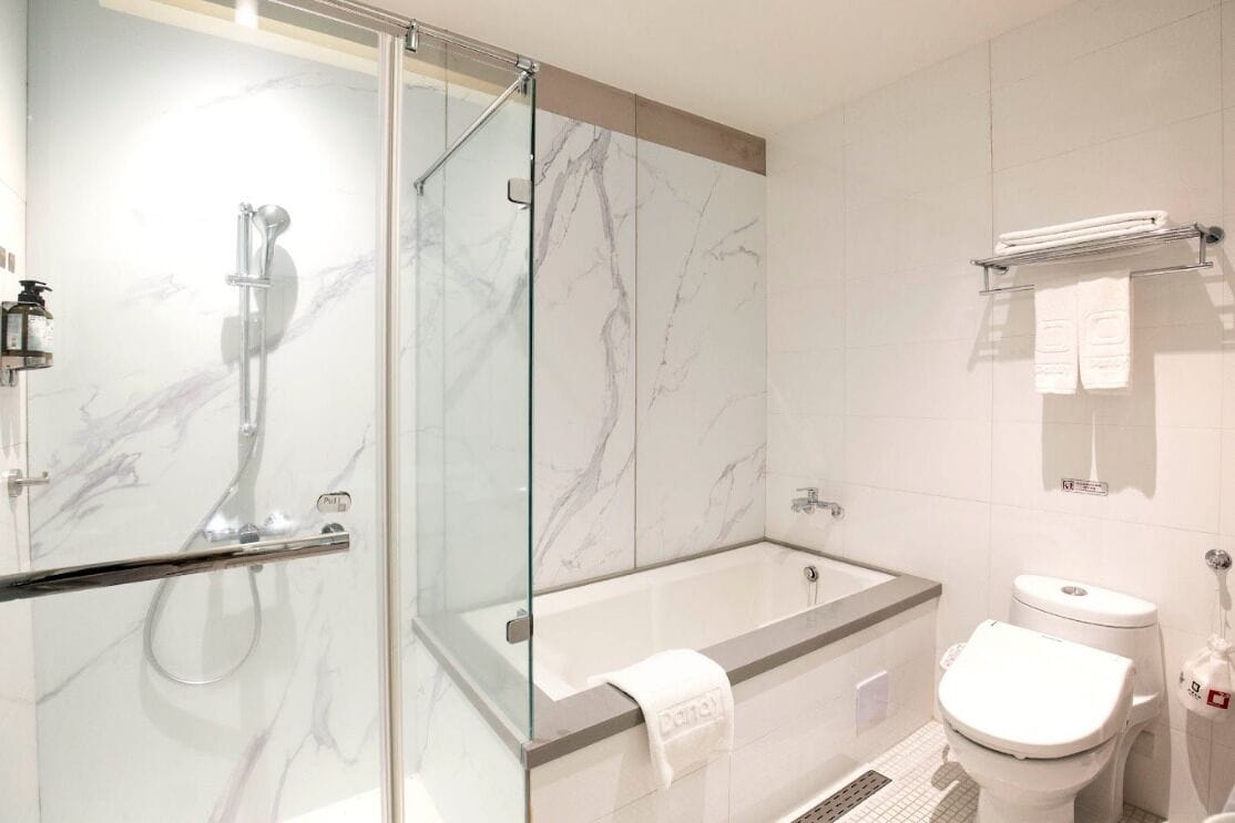 hair dryer, slippers, bidet, towels