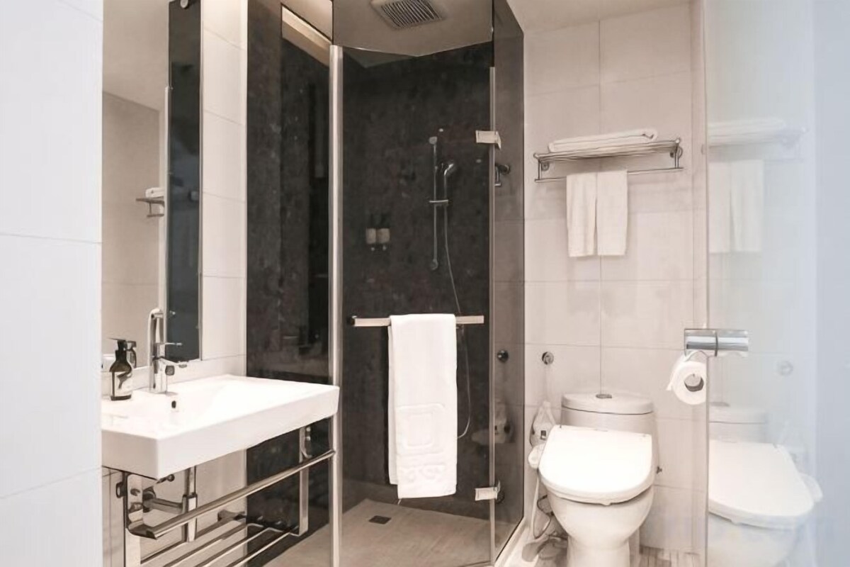 Bathroom | Hair dryer, slippers, bidet, towels