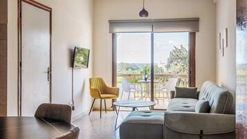 Apartment, 1 Bedroom | Living area | TV