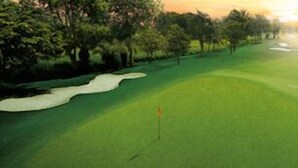 A golf course with sand bunkers and a flagstick. - Pattaya Country Club (Bang Lamung)