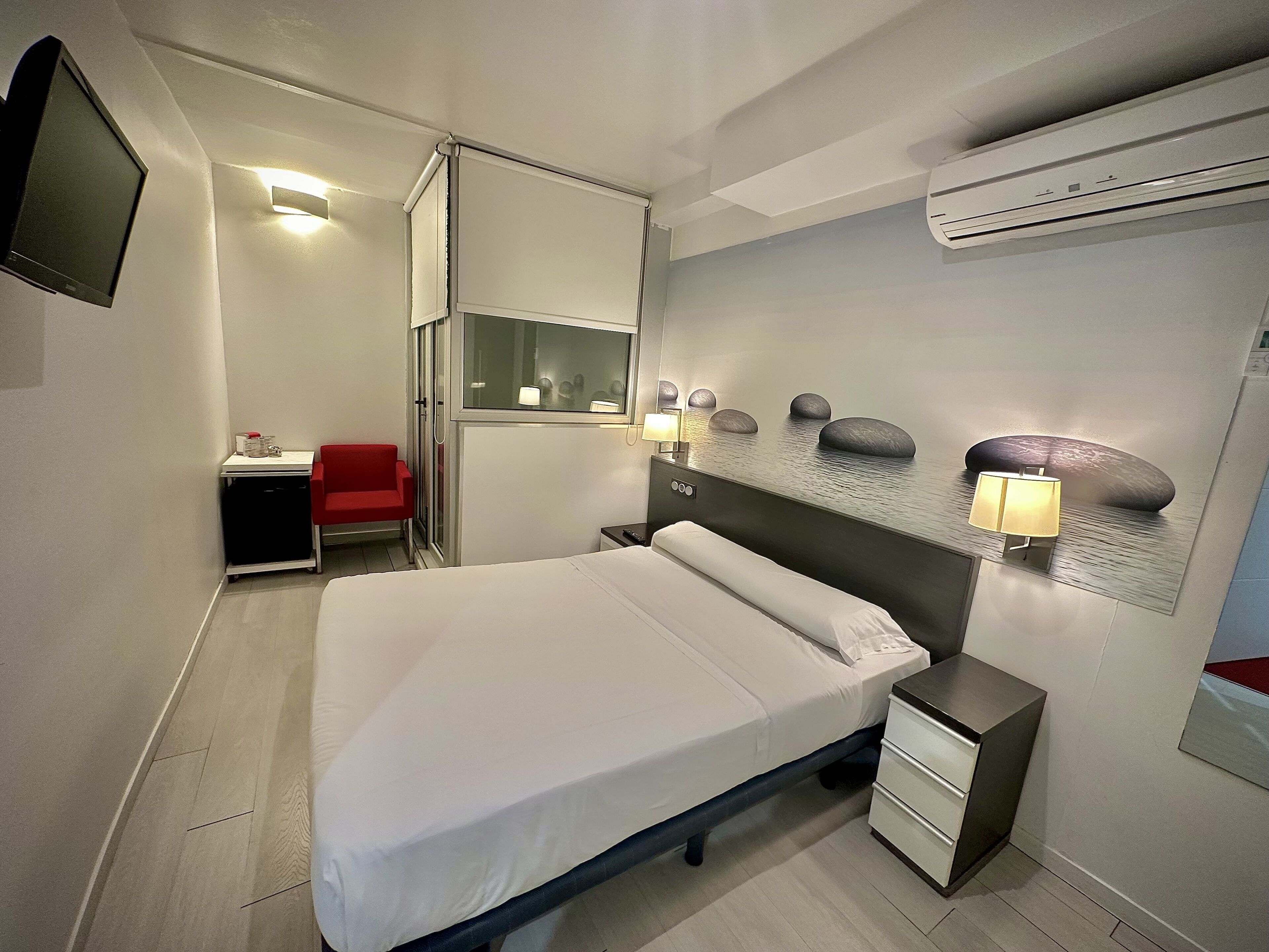 Minibar, iron/ironing board (on request), WiFi (free), bed sheets