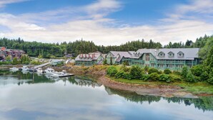 A lakeside town with boats docked, traditional houses, and a clear sky. - Canadian Princess Lodge & Marina (Ucluelet)