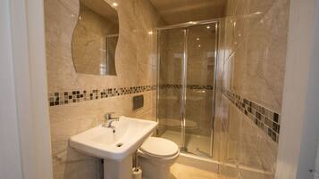 Shower, free toiletries, hair dryer, towels