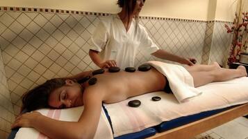 Guests can enjoy soothing massages on a comfortable massage table with a skilled therapist.