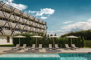 Indoor pool, outdoor pool, pool umbrellas, pool loungers
