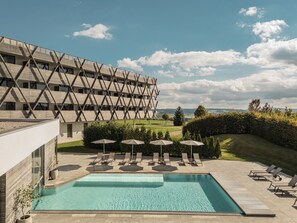 Indoor pool, outdoor pool, pool umbrellas, pool loungers