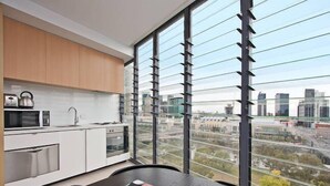 Private kitchenette | Coffee/tea maker, full-sized fridge, microwave, stovetop - Melbourne Holiday Apartments at Northbank – Flinders Street (Melbourne)