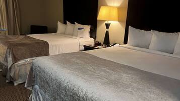 Desk, laptop workspace, iron/ironing board, free cribs/infant beds