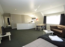 Two Bedroom | Living area | 32-inch LCD TV with satellite channels, TV