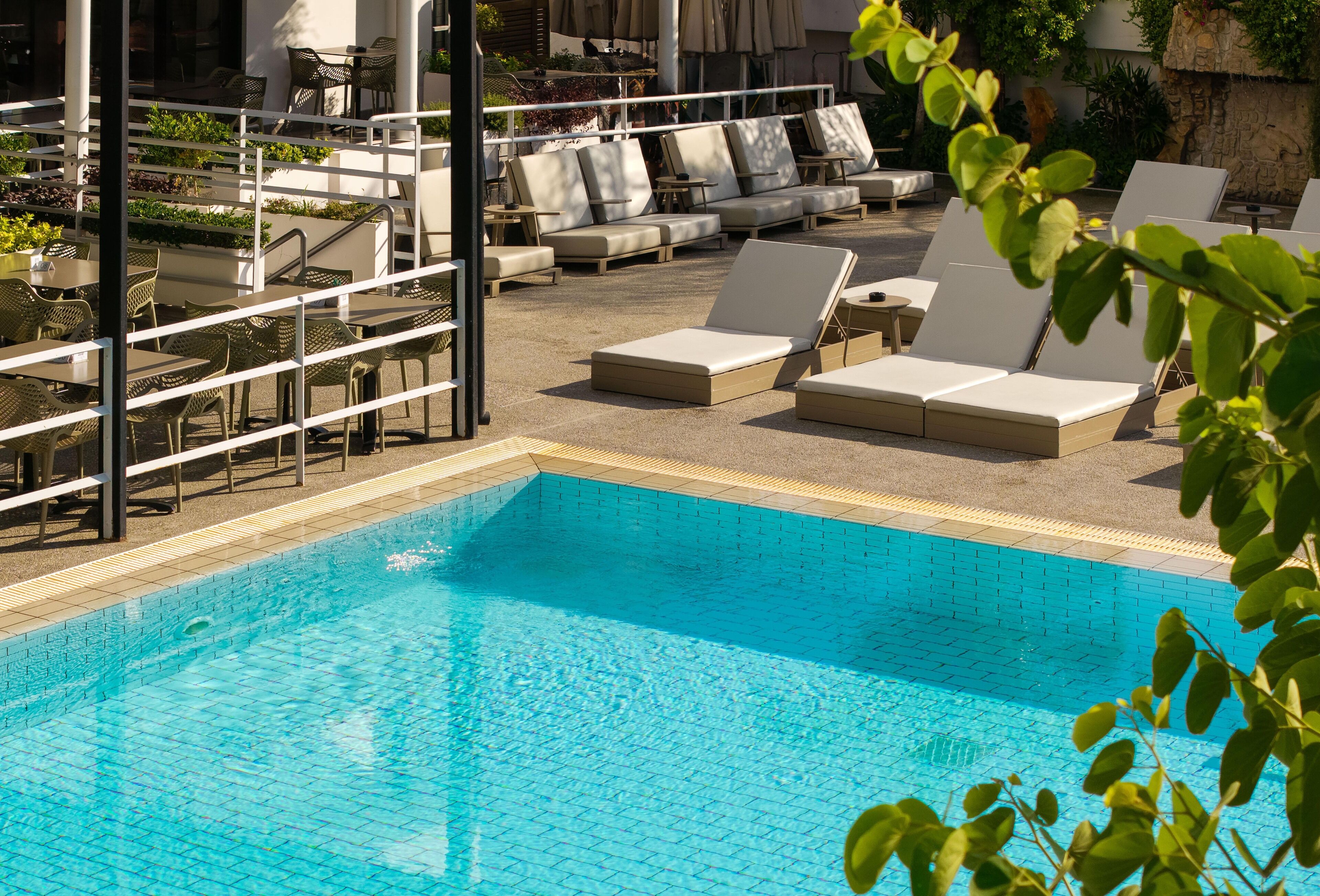 Seasonal outdoor pool, open 8 AM to 7 PM, pool umbrellas, sun loungers