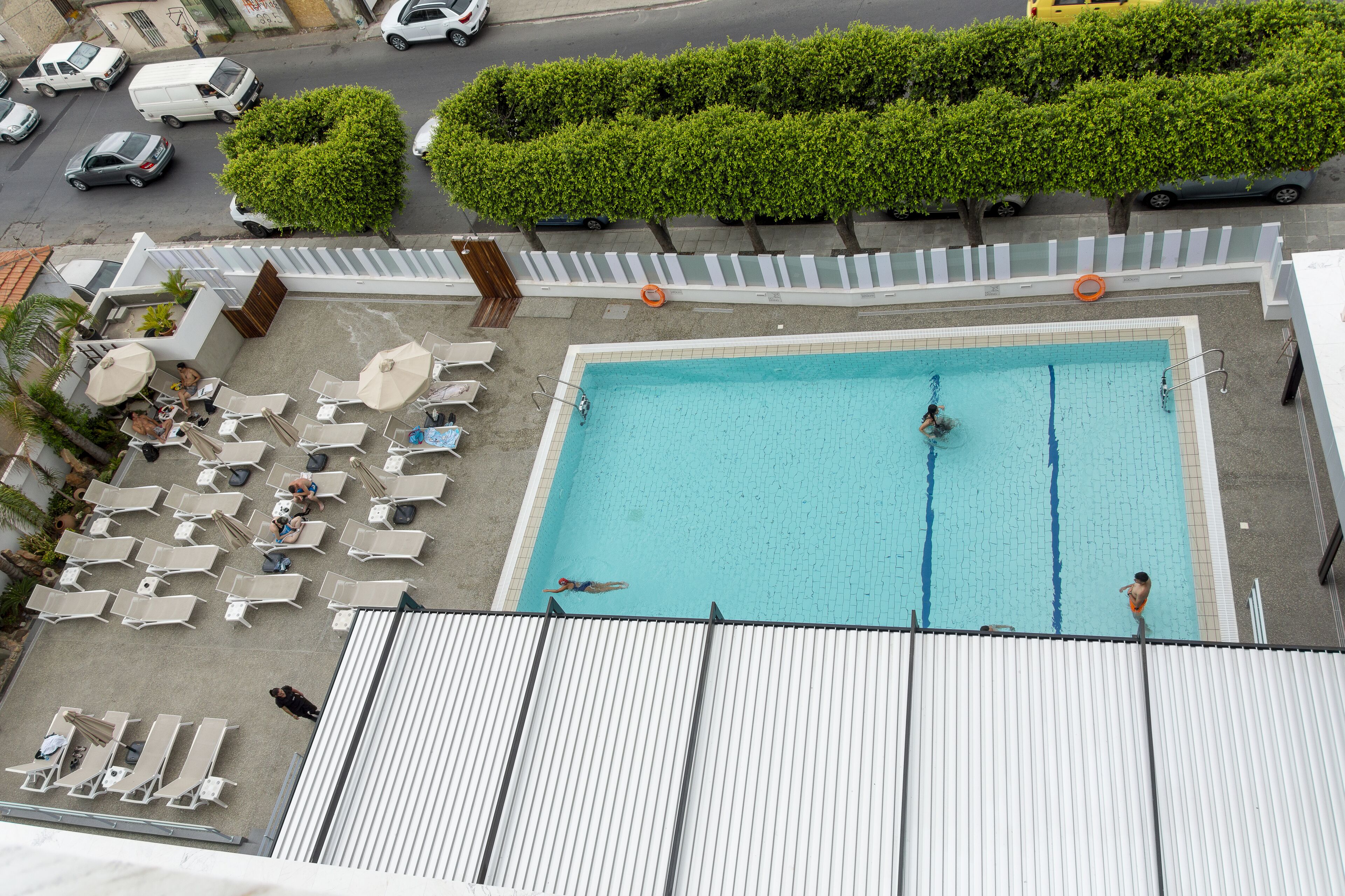 seasonal outdoor pool, open 8 am to 7 pm, pool umbrellas, pool loungers