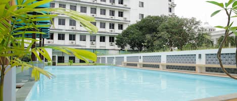 Outdoor pool, open 6:00 AM to 6:00 PM, pool loungers