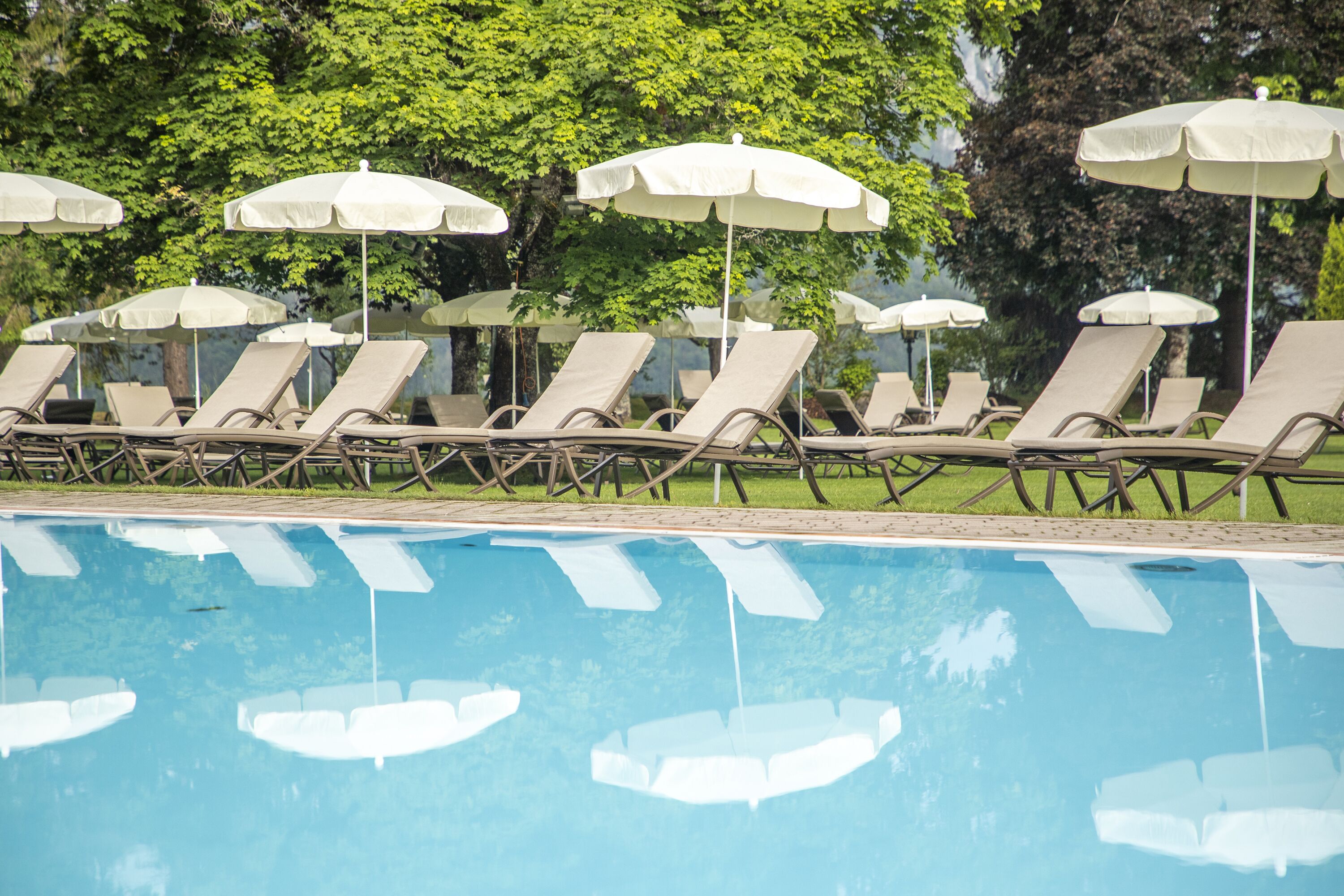 3 indoor pools, seasonal outdoor pool, open 7 am to 7 pm, pool umbrellas