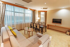 Family Apartment | Living area | 21-inch LCD TV with cable channels, TV, pay films - Dedeman Oskemen Hotel (Oskemen)