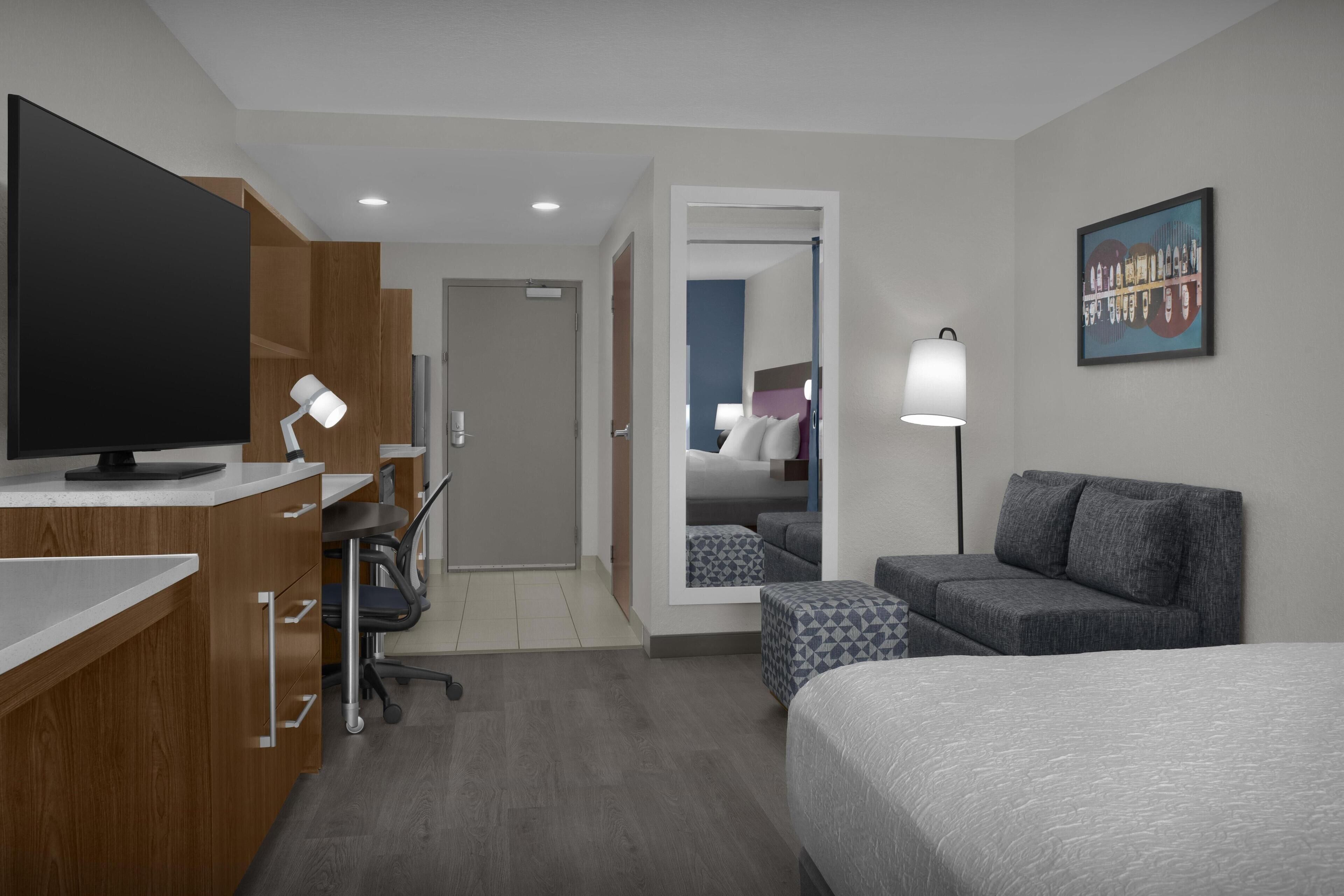 Suite, 1 King Bed | Living area | 40-inch flat-screen TV with cable channels, TV