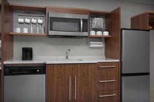 Fridge, microwave, coffee/tea maker, cookware/dishes/utensils