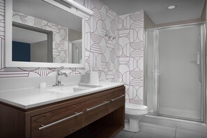 Suite, 1 King Bed | Bathroom | Combined shower/tub, hair dryer, towels