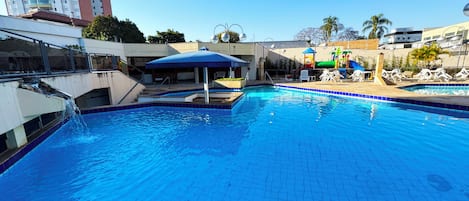 Outdoor pool, pool umbrellas, sun loungers
