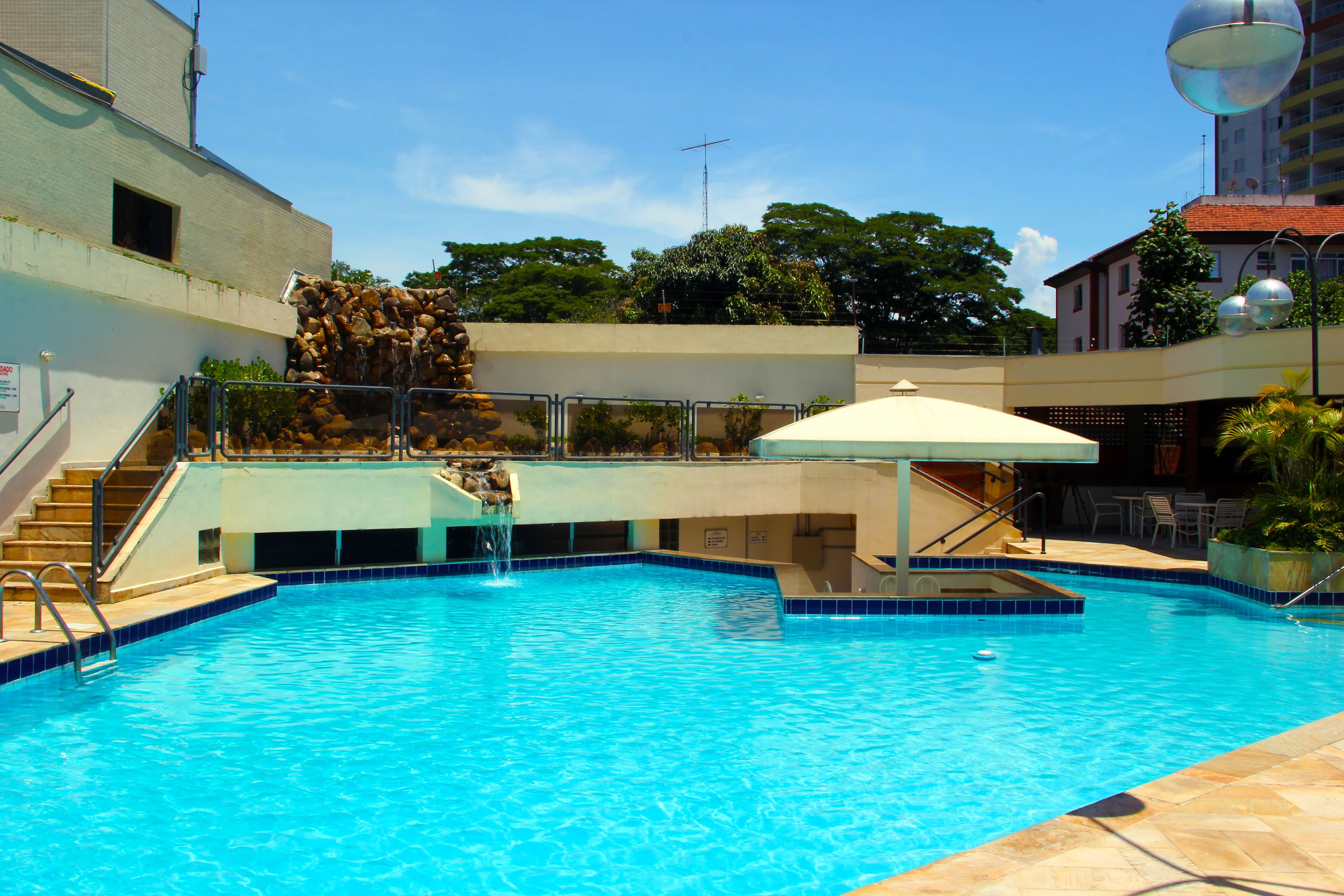 Outdoor pool, pool umbrellas, sun loungers