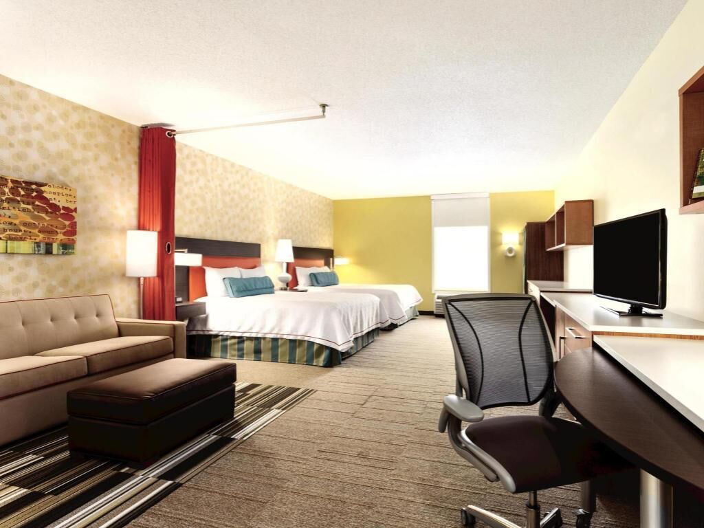 Premium bedding, pillow-top beds, desk, laptop workspace