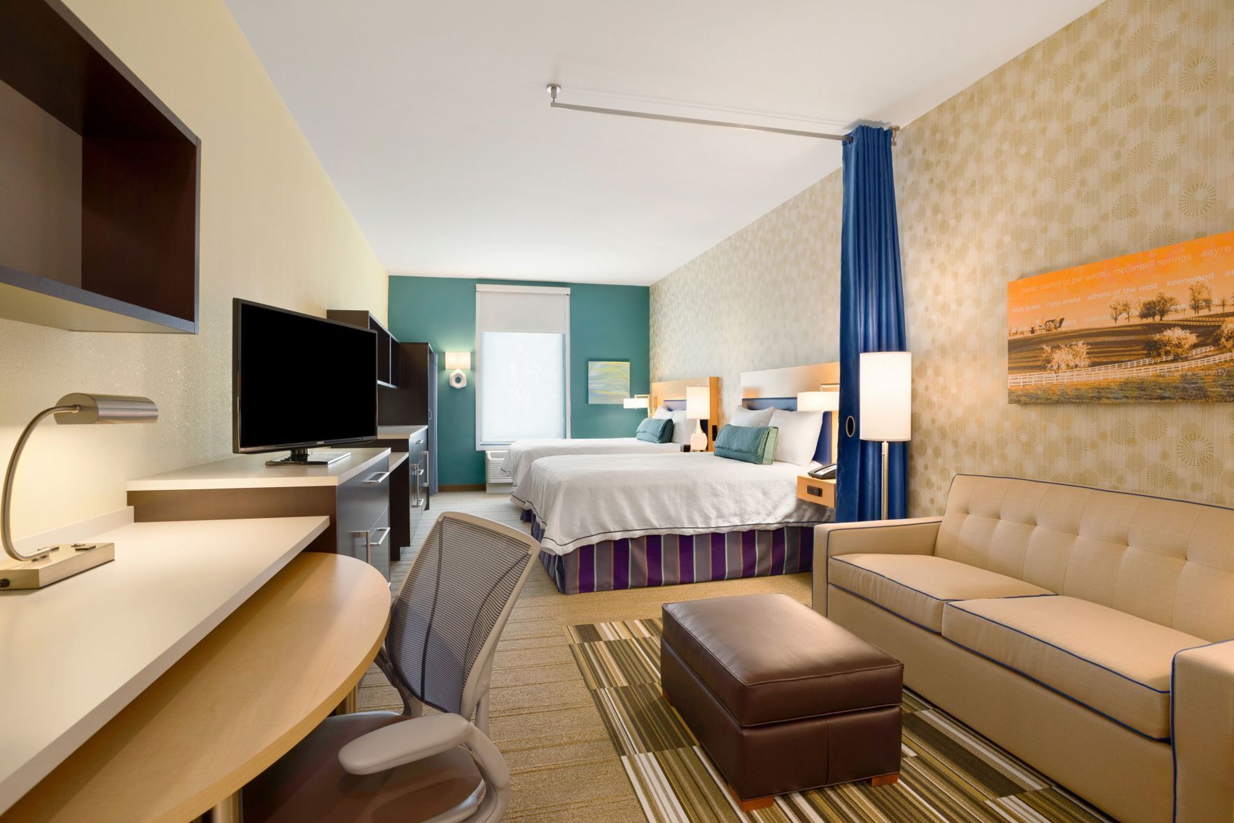 Premium bedding, pillow-top beds, desk, laptop workspace
