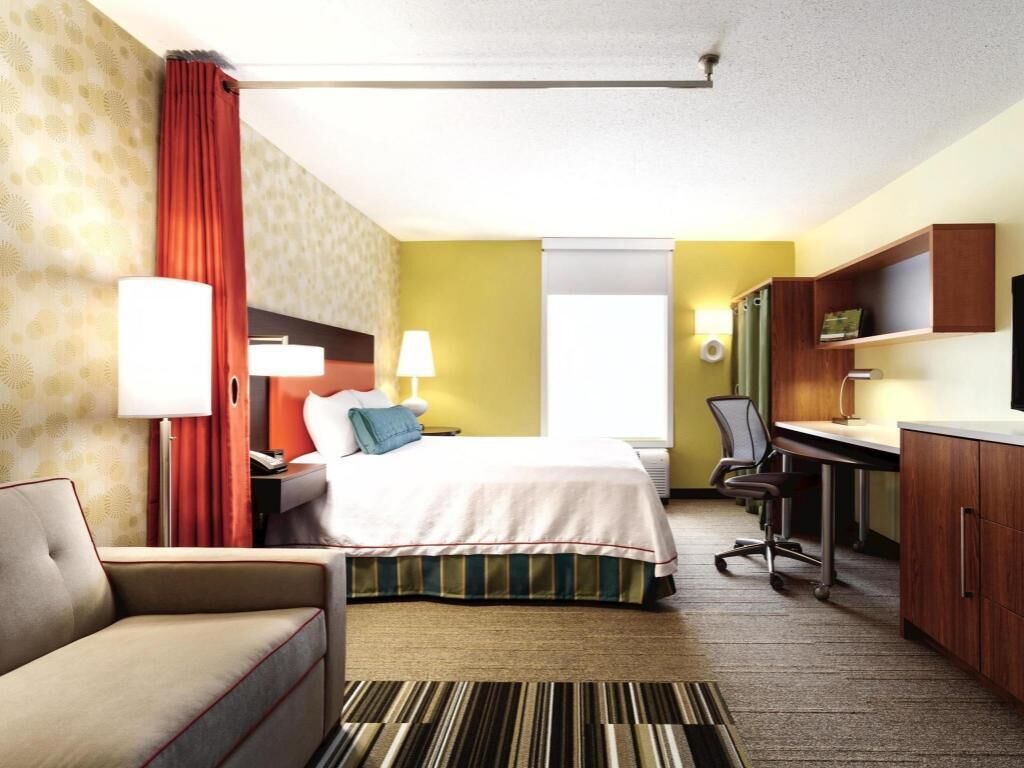 Premium bedding, pillow-top beds, desk, laptop workspace