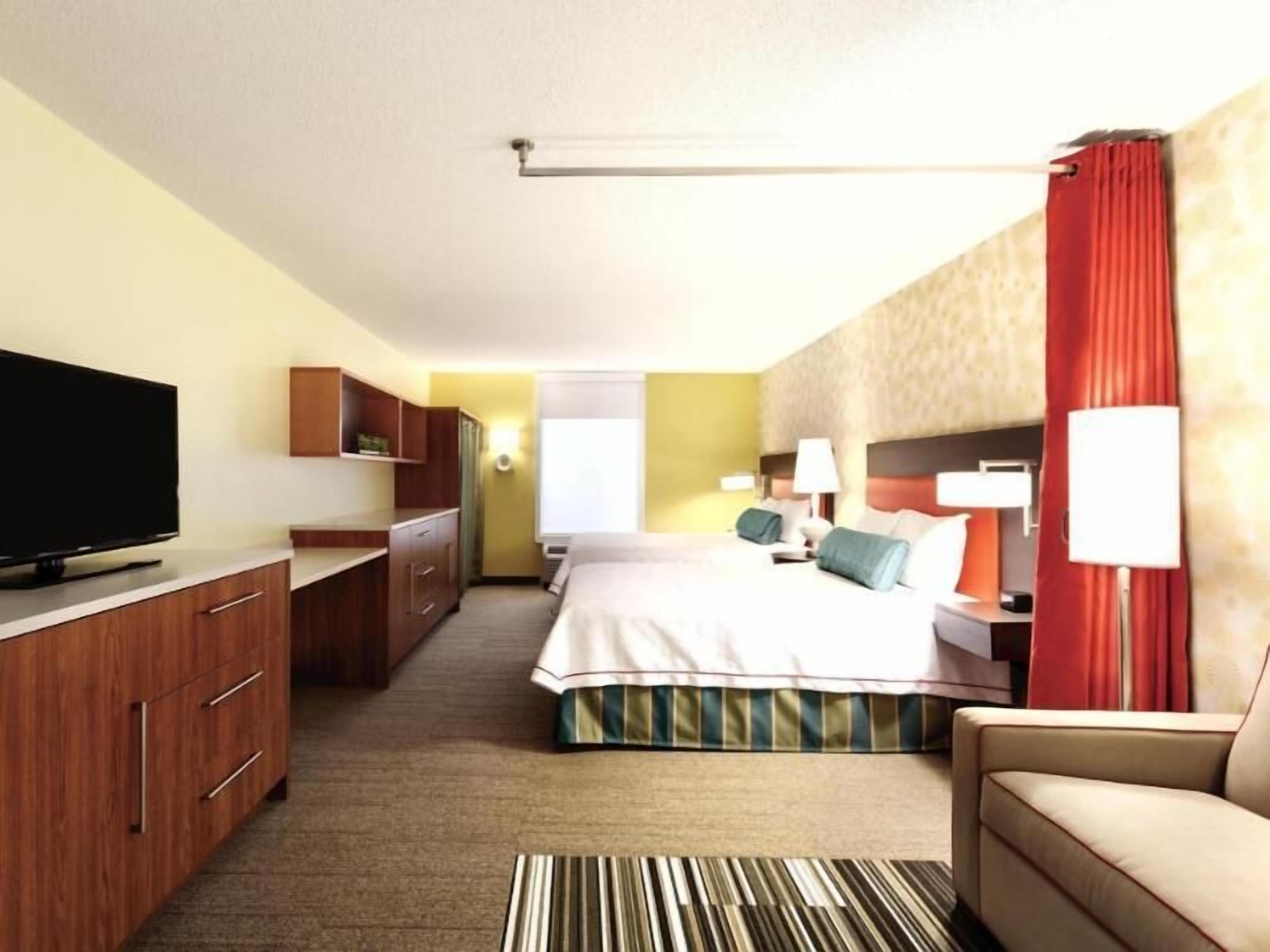 Premium bedding, pillow-top beds, desk, laptop workspace