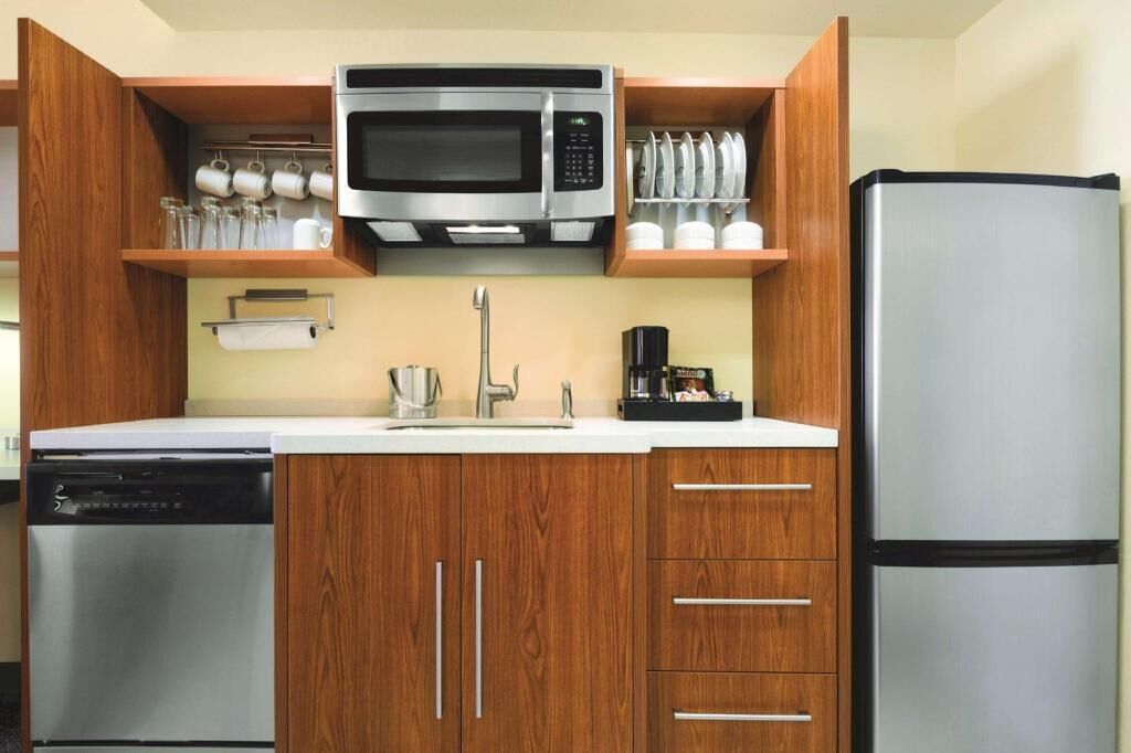 Fridge, microwave, coffee/tea maker, cookware/dishes/utensils