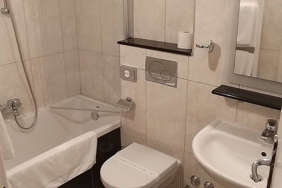 standard double room | bathroom | designer toiletries, hair dryer, towels