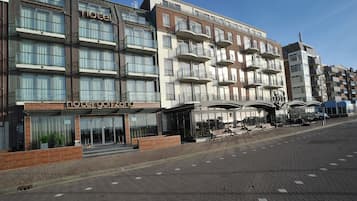 Guests can enjoy expansive outdoor spaces from multiple balconies with glass railings.