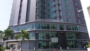 A multi-story hotel with a modern design, featuring large windows and a flat roof. - Midcity Hotel Melaka (Malacca City)