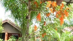 A building with a sloped roof and a visible entrance. - Ladda Resort (Takua Pa)
