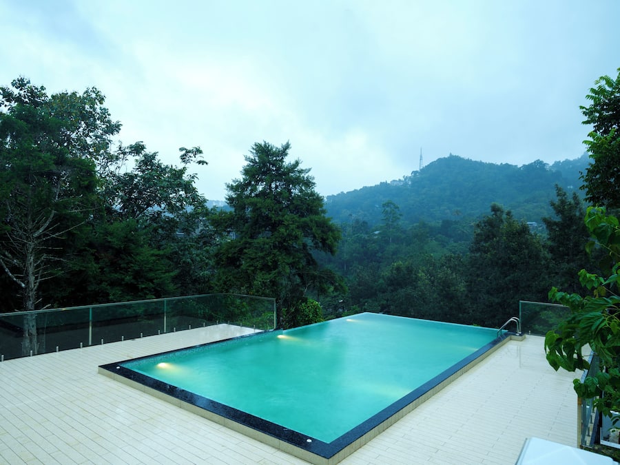 Outdoor pool, open 8:00 AM to 6:00 PM, pool umbrellas